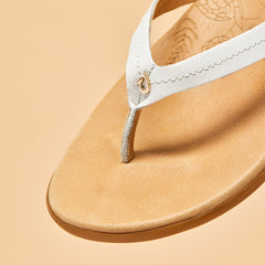 OluKai Women | Honu Women’s Leather Sandals - Bright White / Golden Sand