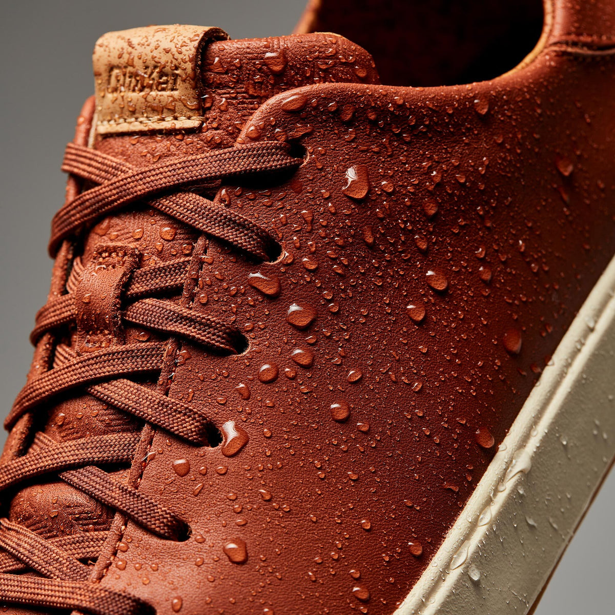 OluKai Men | Lae‘ahi Lī ‘Ili Men's Leather Sneakers - Kukui Brown