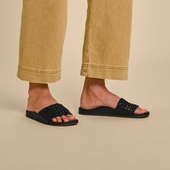 OluKai Women | Kāmola Women’s Leather Slide Sandals - Black
