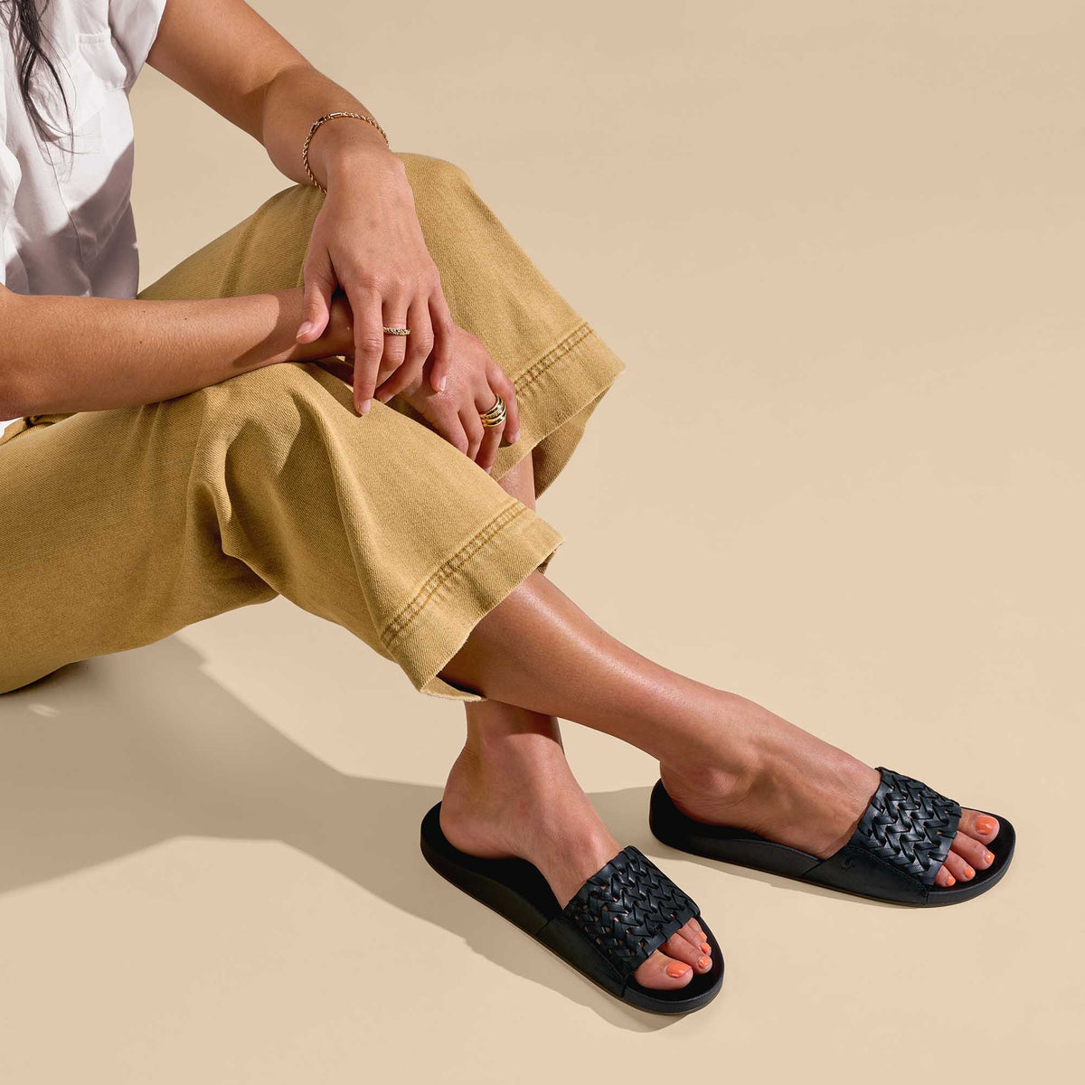 OluKai Women | Kāmola Women’s Leather Slide Sandals - Black