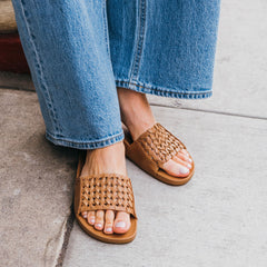 OluKai Women | Kāmola Women’s Leather Slide Sandals - Tan